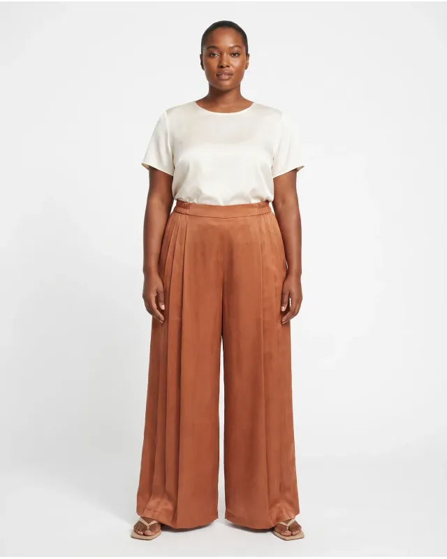 Pixfocal result showing the rust-colored wide-leg trousers on an AI model